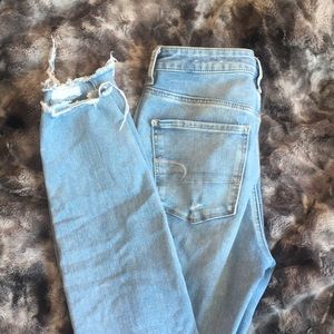 light blue skinny jeans with holes